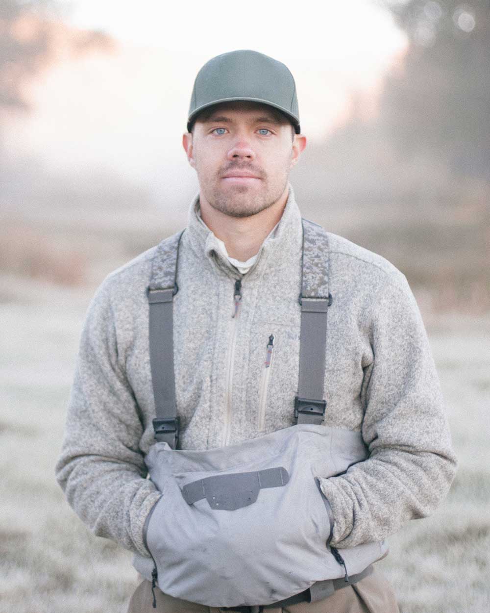 a fisherman standing with hands in his pockets in KEYK989
