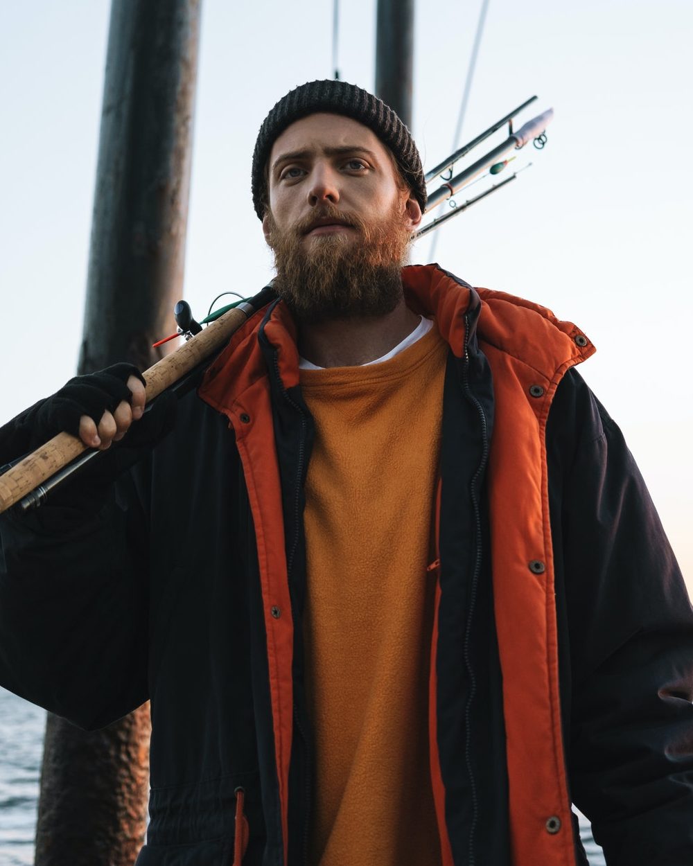 handsome brutal bearded fisherman wearing coat e1634217670380